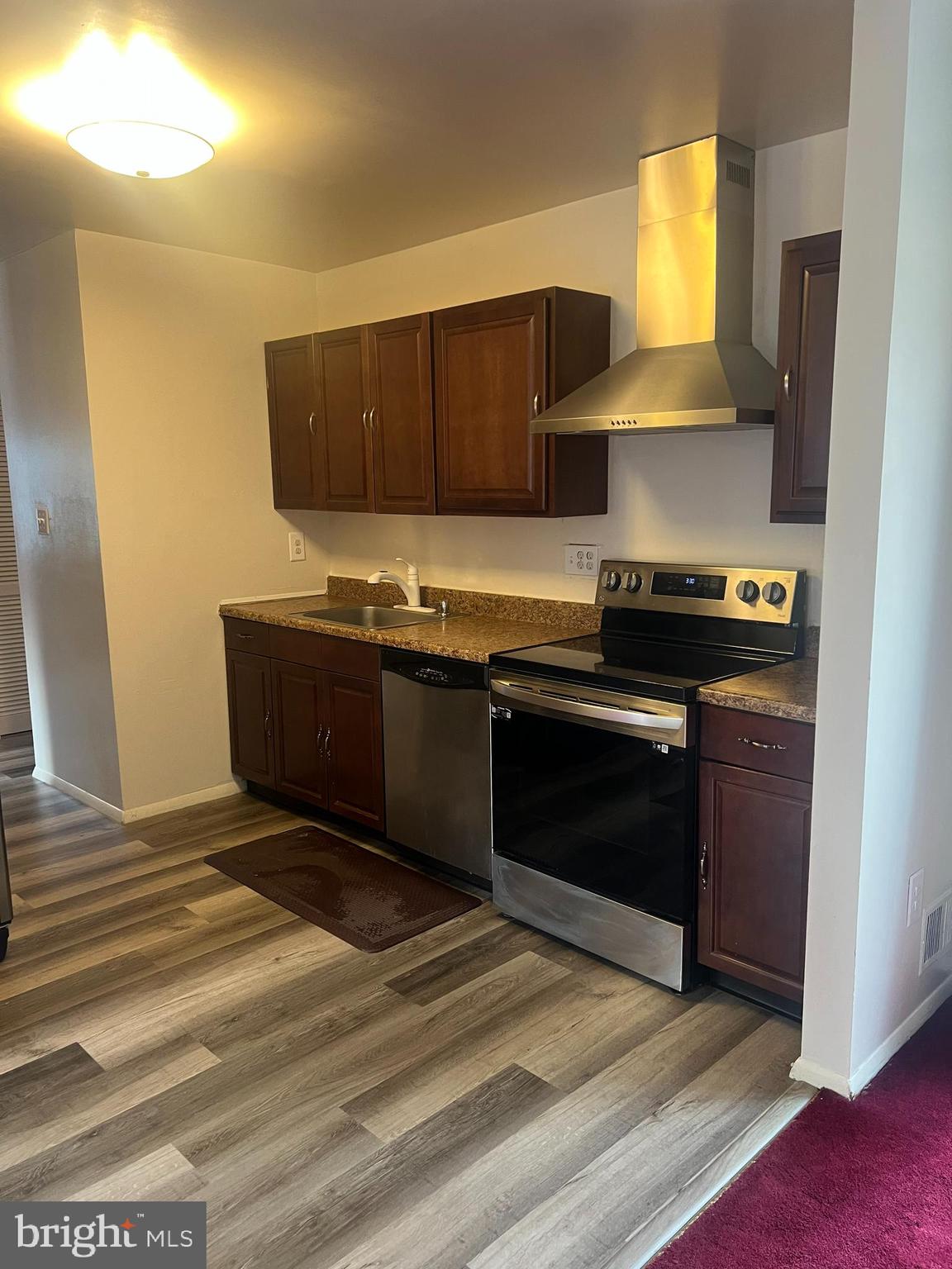 2216 Sanibel Drive Reston, VA 20191 - Photo 5 of 15 a kitchen with a sink and a stove