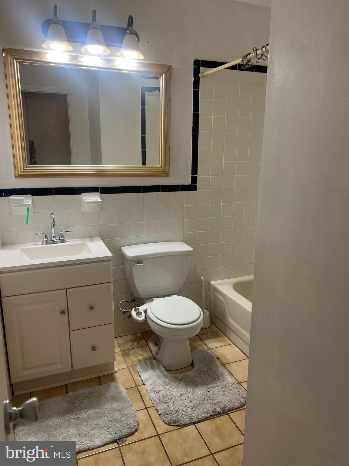 2216 Sanibel Drive Reston, VA 20191 - Photo 8 of 15 a bathroom with a toilet sink and mirror
