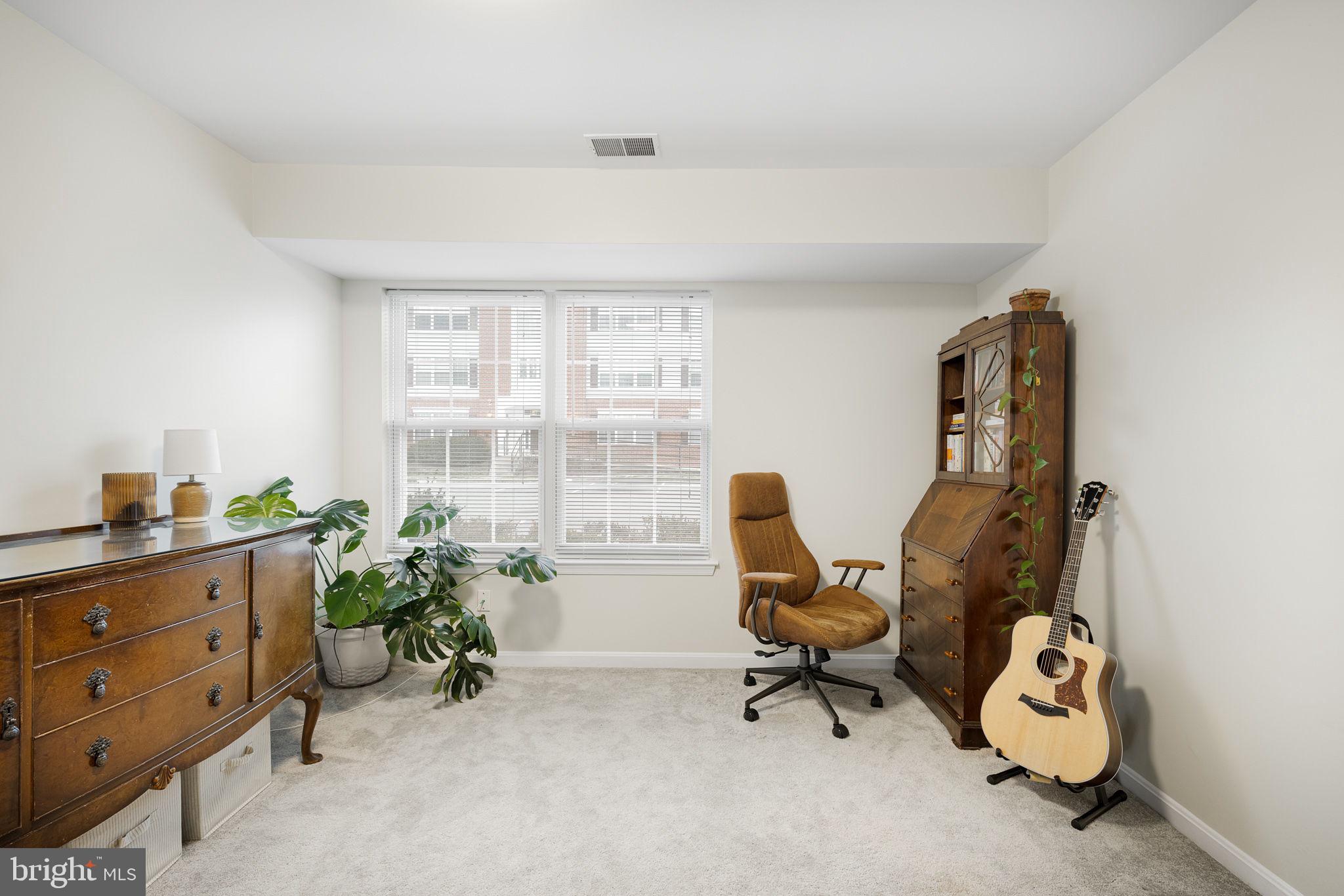 645 Constellation Square Southeast, Unit B Leesburg, VA 20175 - Photo 16 of 17 a view of a workspace with furniture and a window