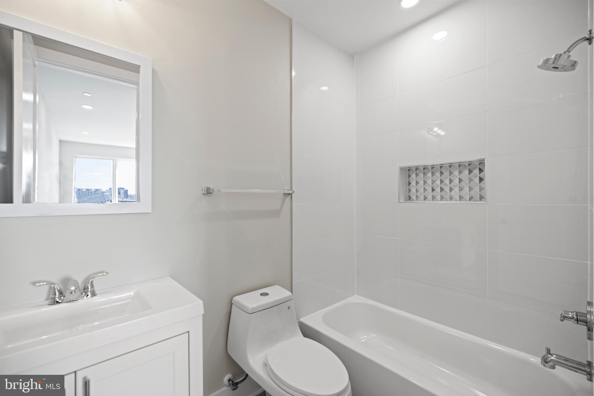 824 18th Street Northeast, Unit 304 Washington, DC 20002 - Photo 6 of 25 a bathroom with a toilet sink and bathtub