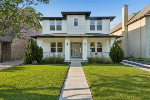 a front view of a house with yard
