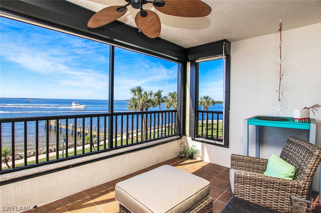 15011 Punta Rassa Road, Unit 204 Fort Myers, FL 33908 - Photo 11 of 23 a balcony with furniture