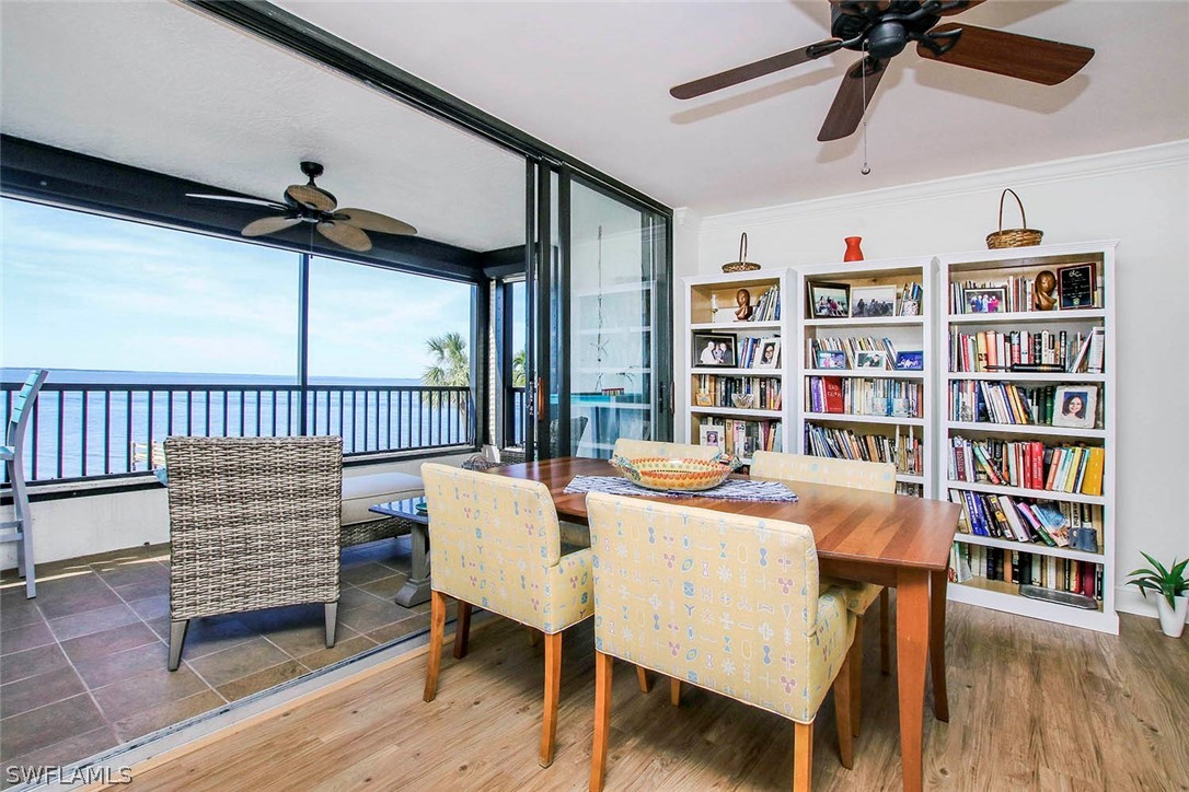 15011 Punta Rassa Road, Unit 204 Fort Myers, FL 33908 - Photo 6 of 23 a dining room with furniture window and wooden floor