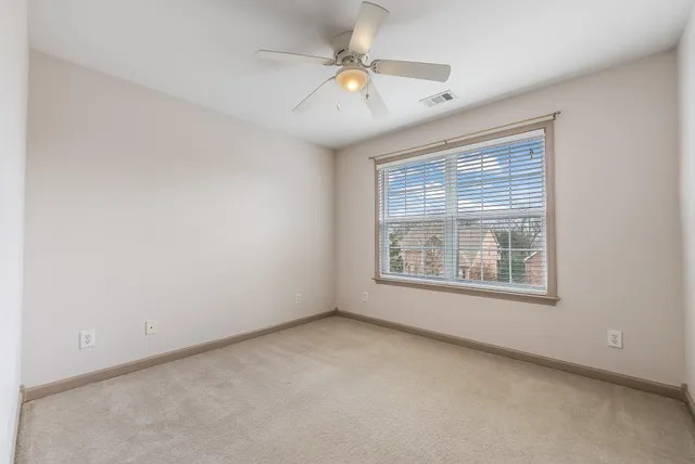 a bathroom with a sink double vanity granite tub and a mirror