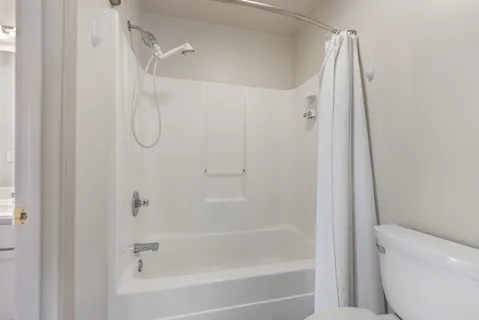 a view of a swimming pool and lounge chairs