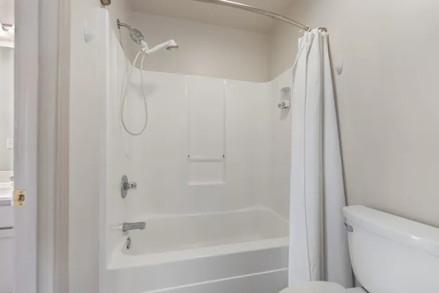 a view of a swimming pool and lounge chairs