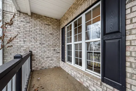 a view of a brick house with a window