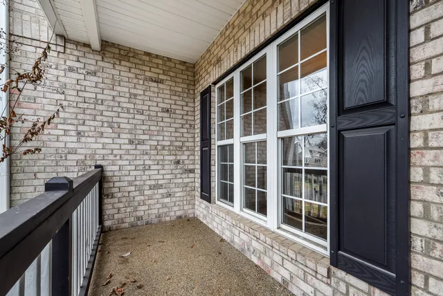 a view of a brick house with a window