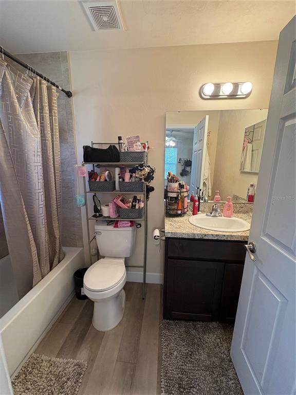 13002 Southwest 174th Street Archer, FL 32618 - Photo 3 of 10 a bathroom with a sink toilet and a mirror