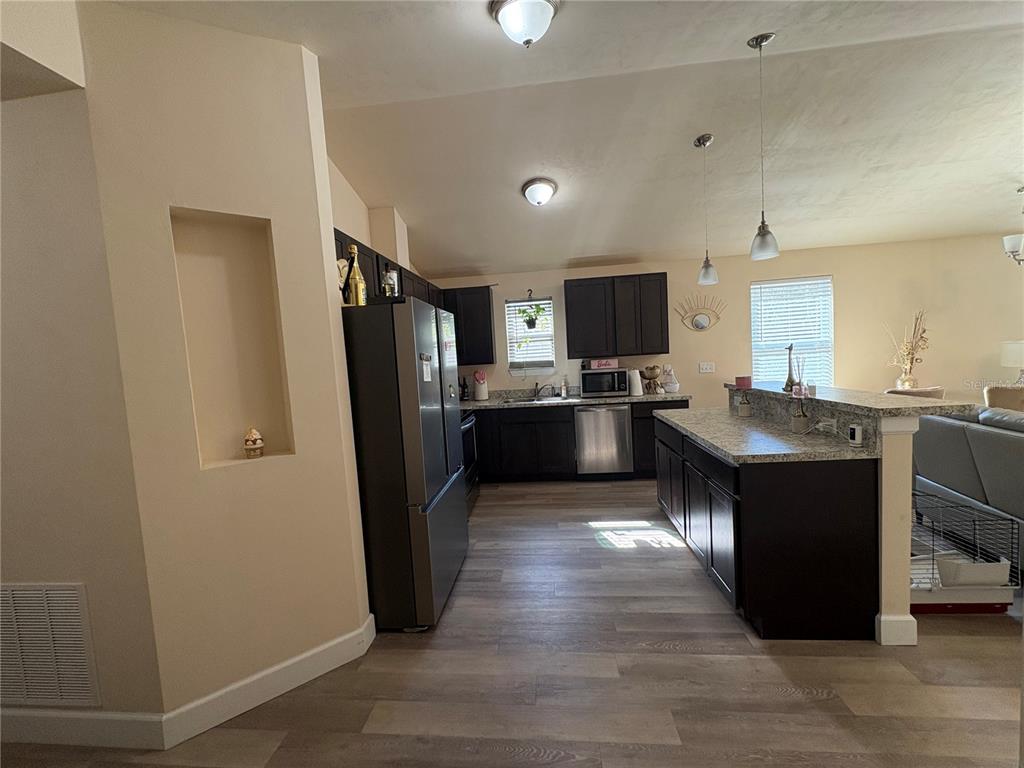 13002 Southwest 174th Street Archer, FL 32618 - Photo 10 of 10 a kitchen with a refrigerator and a sink