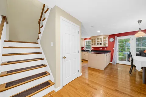 a view of kitchen with furniture and wooden floor