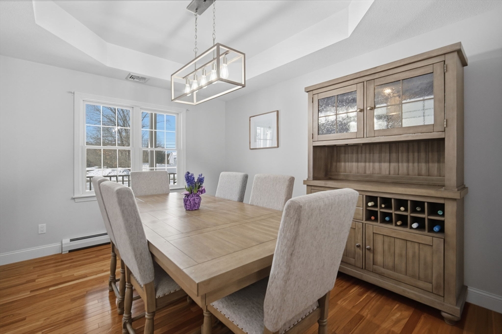 56 Old Lyman Road South Hadley, MA 01075 - Photo 12 of 40 a view of a dining room with furniture a chandelier and wooden floor