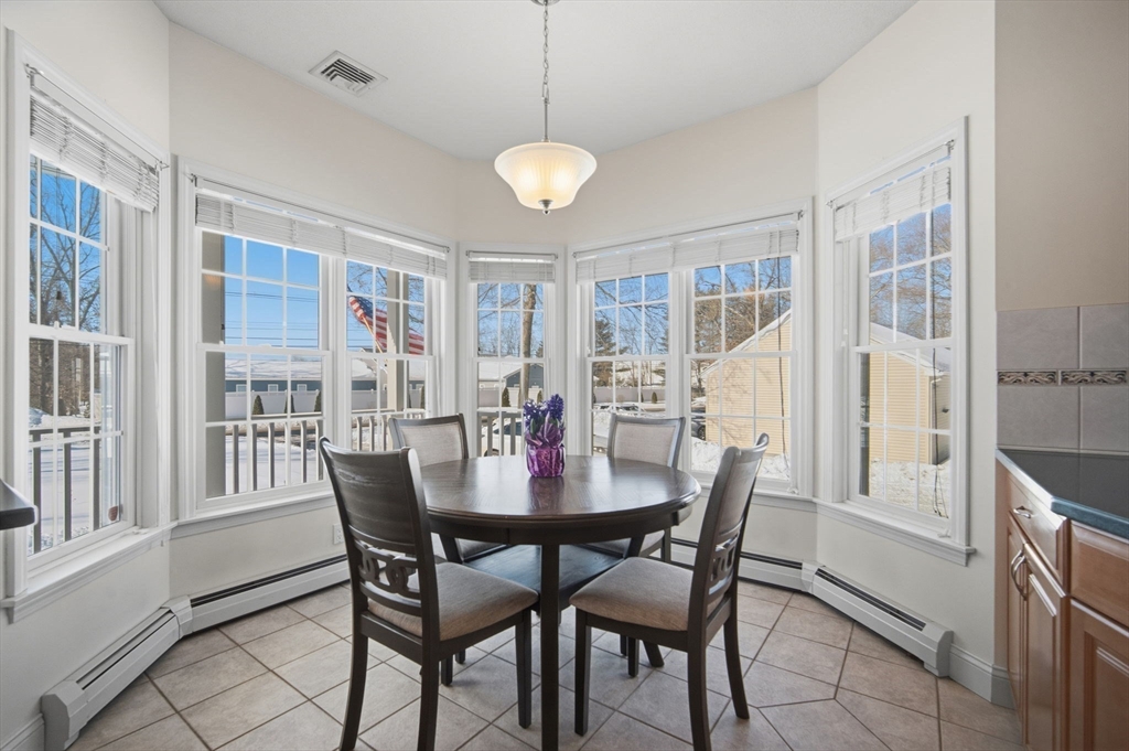56 Old Lyman Road South Hadley, MA 01075 - Photo 16 of 40 a view of a dining room with furniture window and wooden floor