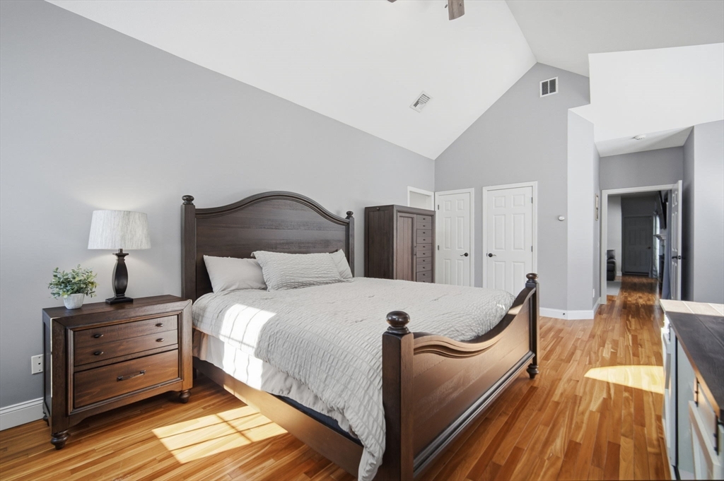 56 Old Lyman Road South Hadley, MA 01075 - Photo 18 of 40 a bedroom with a bed and wooden floor