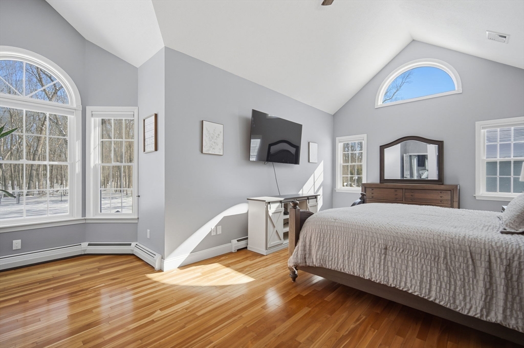 56 Old Lyman Road South Hadley, MA 01075 - Photo 19 of 40 a bedroom with a bed wooden floor and window