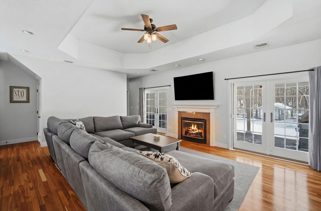 56 Old Lyman Road South Hadley, MA 01075 - Photo 6 of 40 a living room with furniture a fireplace and a flat screen tv
