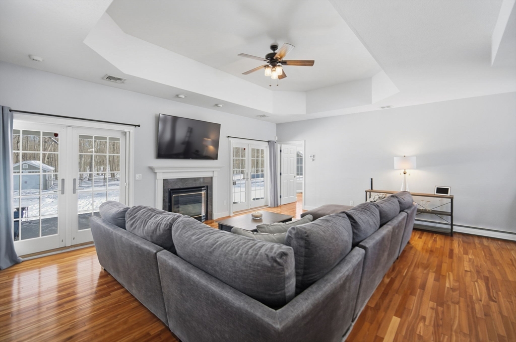 56 Old Lyman Road South Hadley, MA 01075 - Photo 9 of 40 a living room with furniture fireplace and flat screen tv