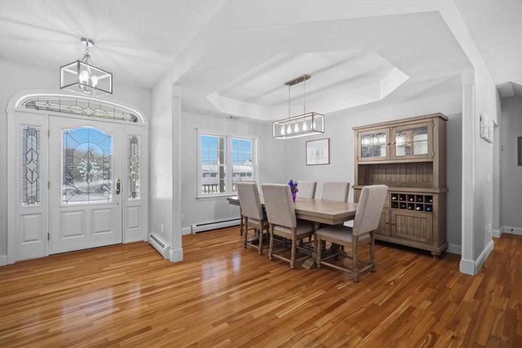 56 Old Lyman Road South Hadley, MA 01075 - Photo 10 of 40 a view of a dining room with furniture window and wooden floor