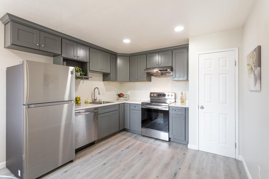 93 Shaniko Common, Unit 24 Fremont, CA 94539 - Photo 11 of 25 a kitchen with stainless steel appliances a refrigerator sink and microwave