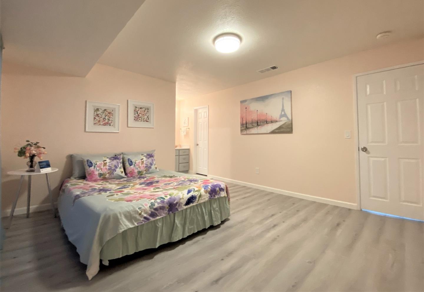 93 Shaniko Common, Unit 24 Fremont, CA 94539 - Photo 12 of 25 a bedroom with a bed and a painting on the wall