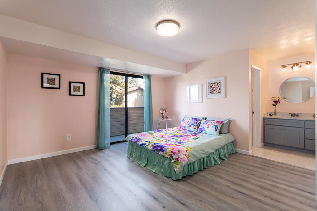 93 Shaniko Common, Unit 24 Fremont, CA 94539 - Photo 13 of 25 a bedroom with a bed and a dresser