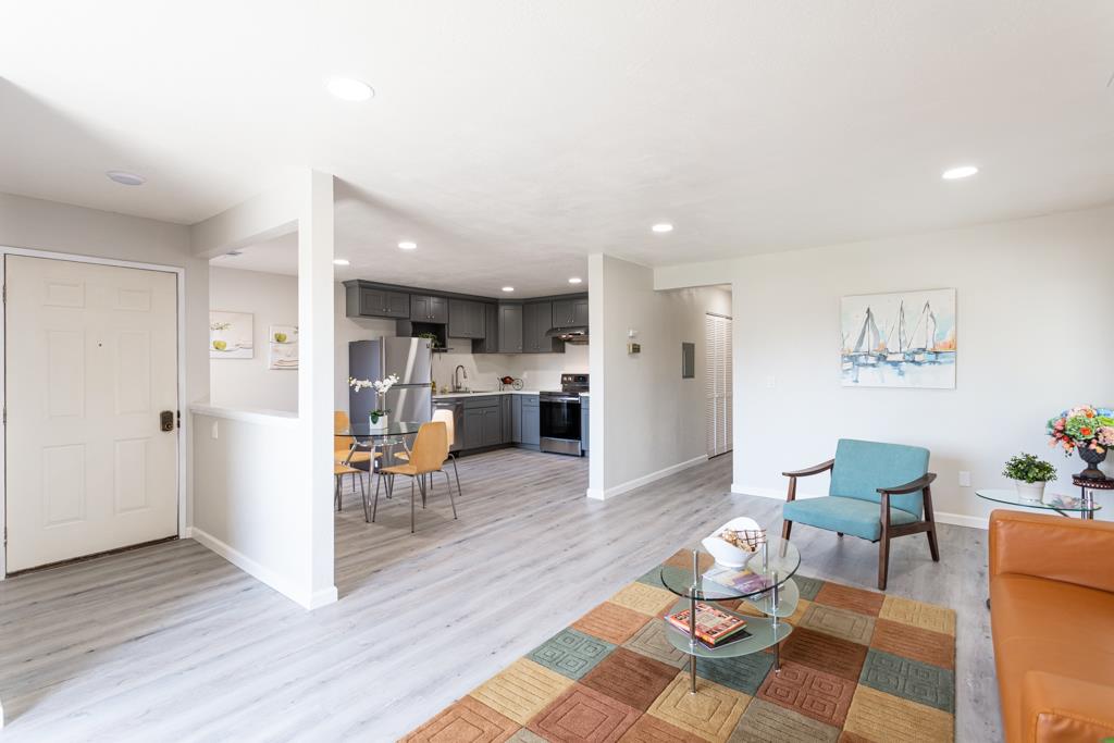 93 Shaniko Common, Unit 24 Fremont, CA 94539 - Photo 3 of 25 a living room with furniture and kitchen view