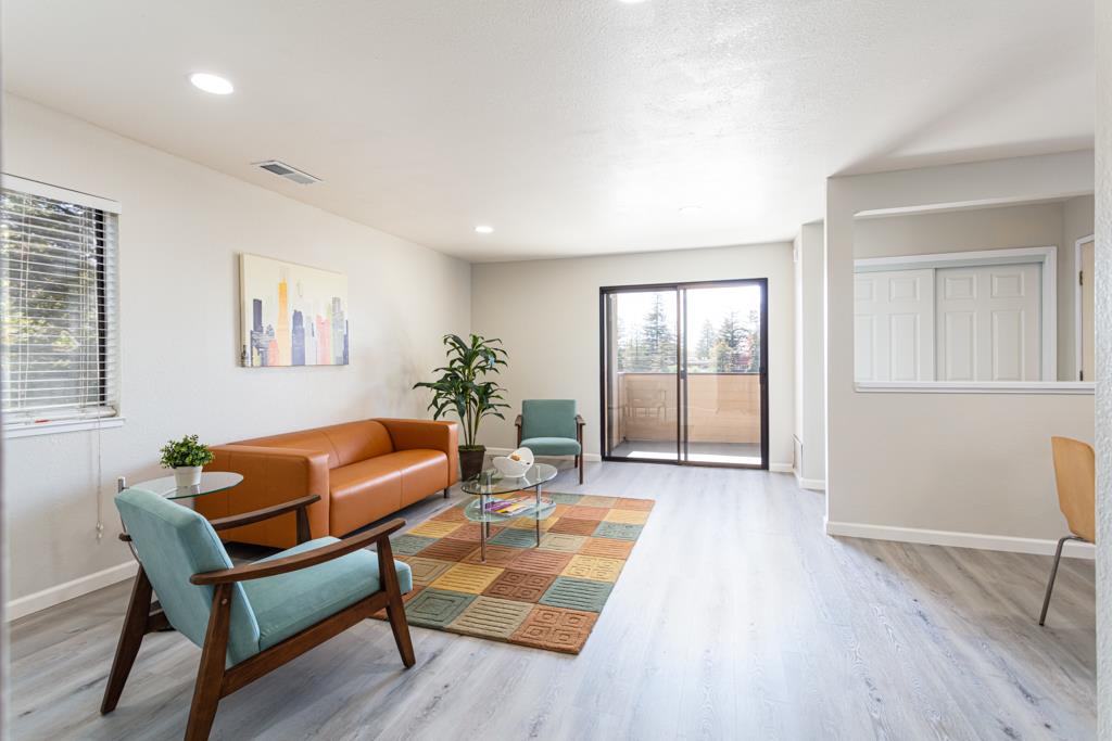 93 Shaniko Common, Unit 24 Fremont, CA 94539 - Photo 5 of 25 a room with furniture and wooden floor