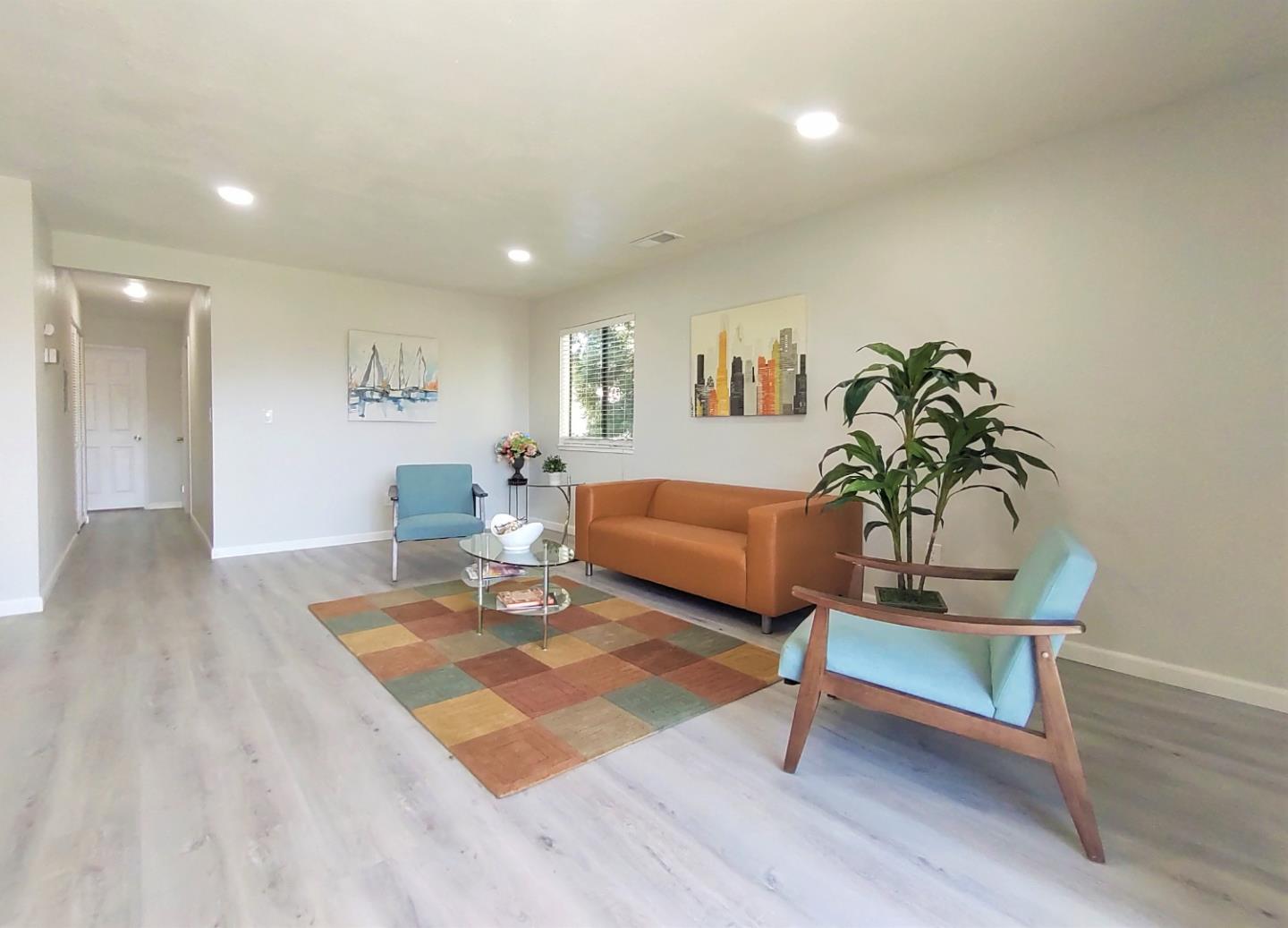 93 Shaniko Common, Unit 24 Fremont, CA 94539 - Photo 7 of 25 a living room with furniture and a potted plant