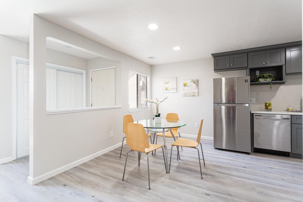93 Shaniko Common, Unit 24 Fremont, CA 94539 - Photo 10 of 25 a kitchen with stainless steel appliances granite countertop a refrigerator and microwave
