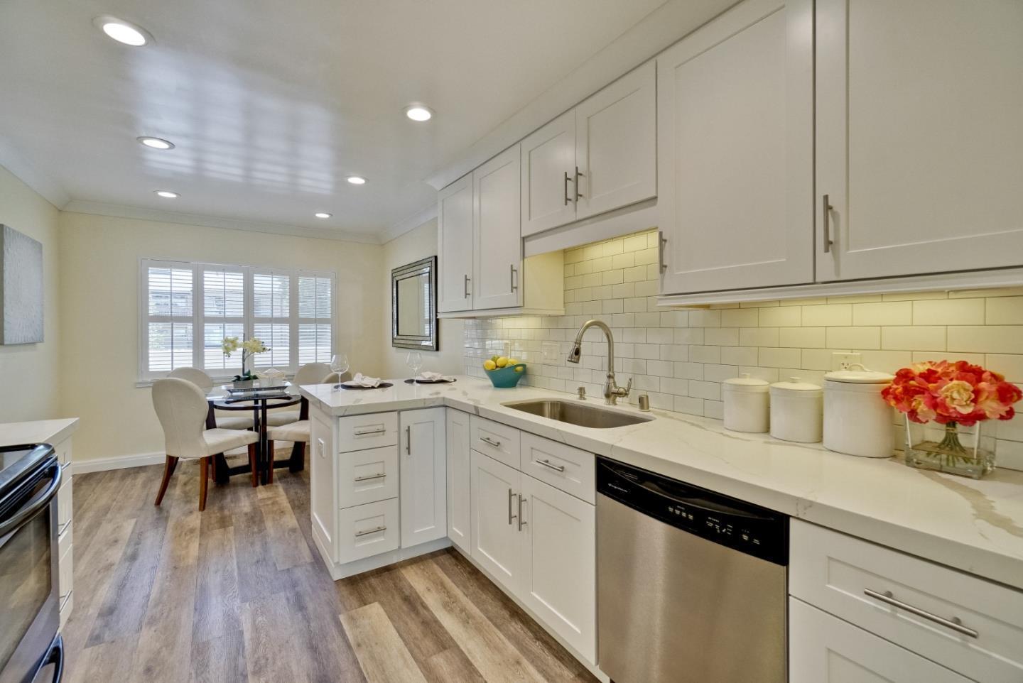 2317 Sharon Road Menlo Park, CA 94025 - Photo 2 of 4 a kitchen with white cabinets and sink