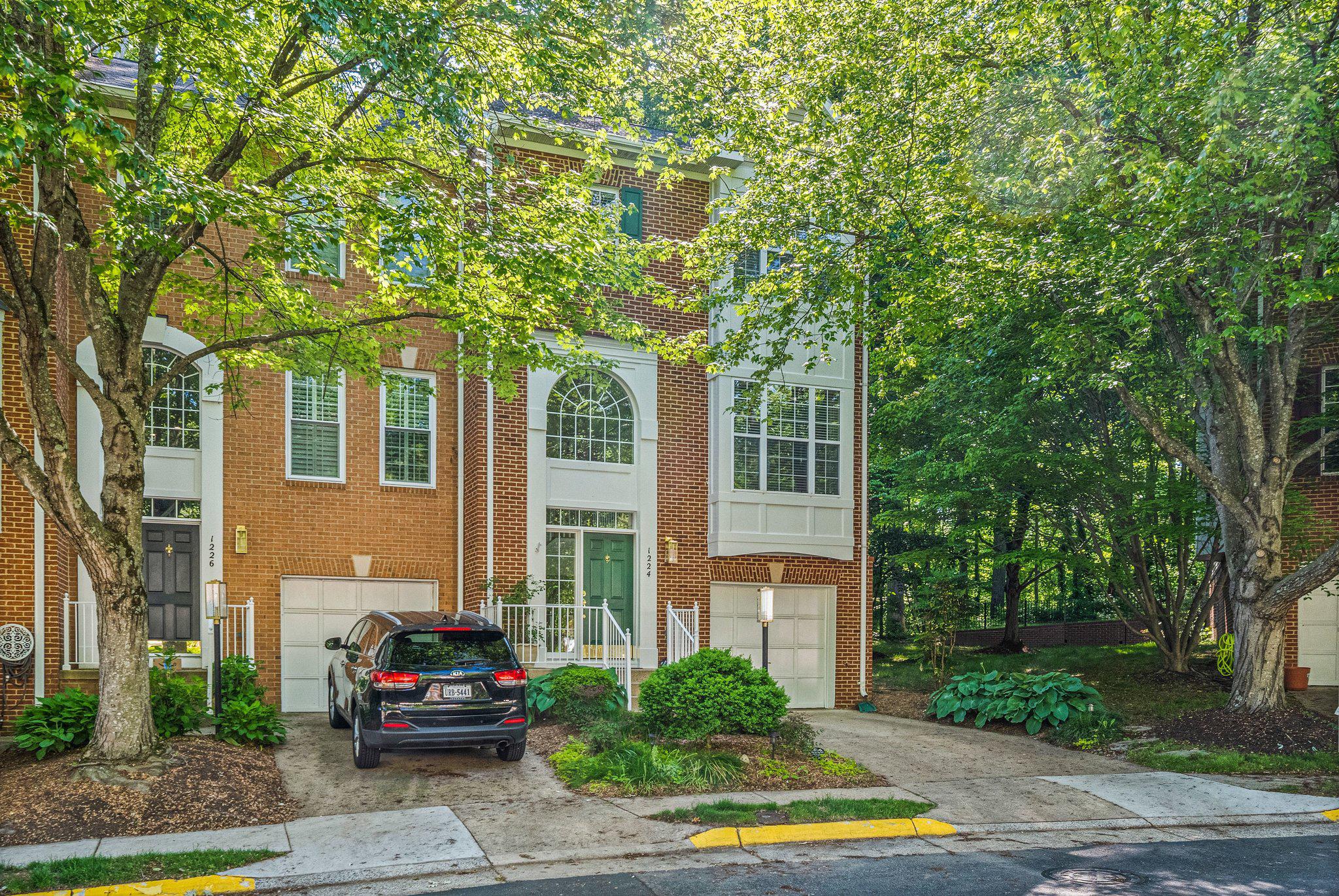 1224 Wild Hawthorn Way Reston, VA 20194 - Photo 3 of 3 Charming brick home in lush greenery.