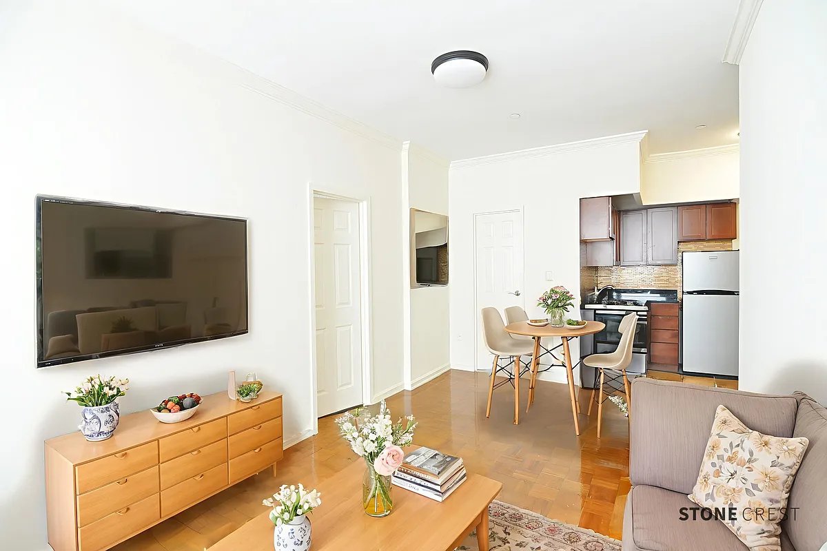 304 West 92nd Street, Unit 5A Manhattan, NY 10025 - Photo 3 of 12 a living room with furniture and a flat screen tv