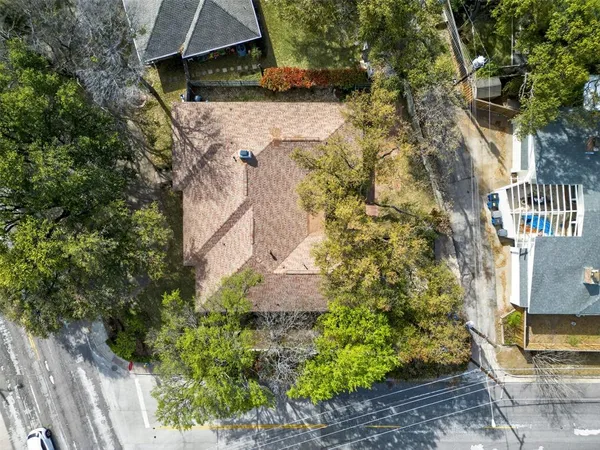 a aerial view of a house with a yard