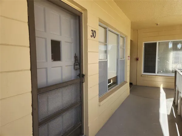 a view of a hallway with a refrigerator