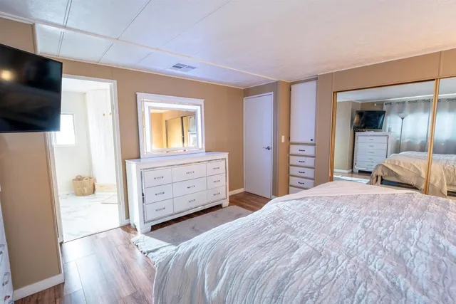 a spacious bathroom with a double vanity sink and a mirror