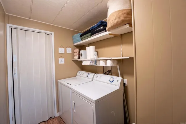a bedroom with a bed flat screen tv and on the wall