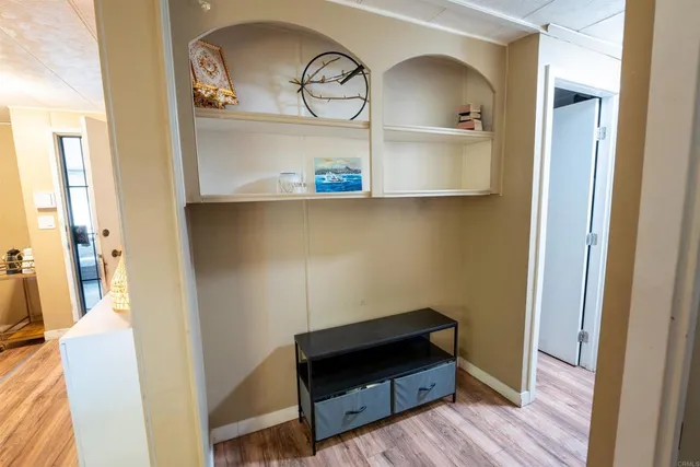 a bathroom with a sink a toilet a mirror and vanity