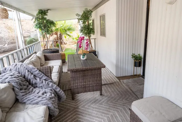 a view of a pathway of a house with wooden fence