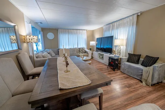 a spacious bathroom with a double vanity sink and a mirror