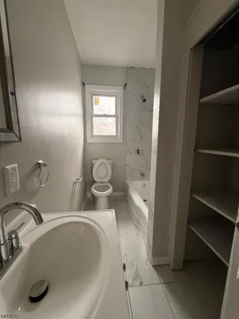 a bathroom with a sink and a toilet