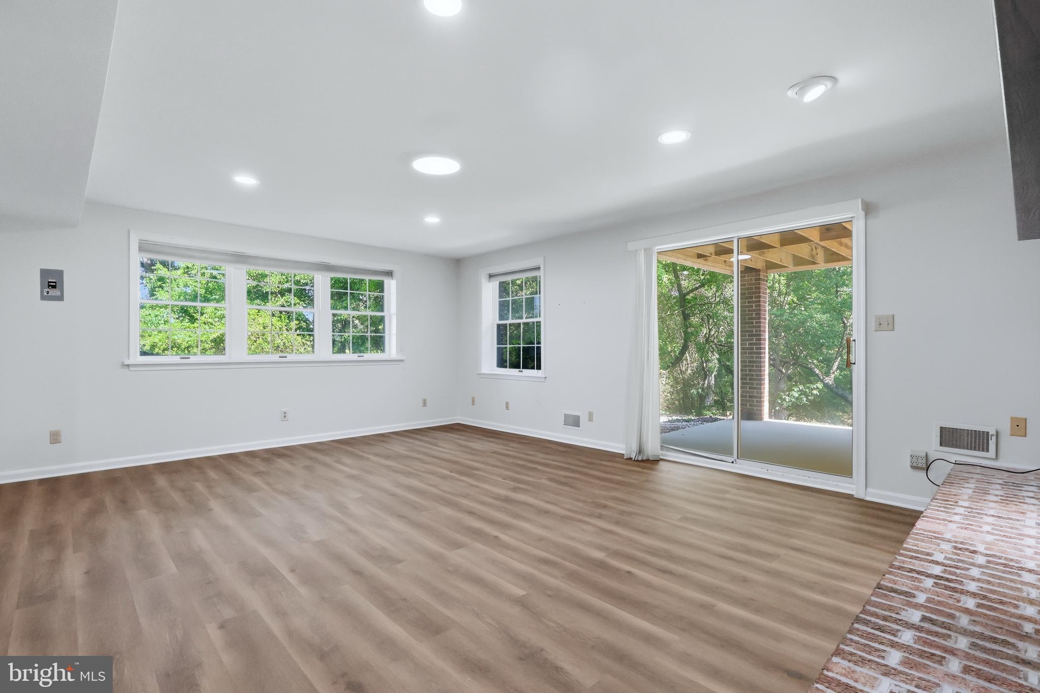 23500 River Road Lexington Park, MD 20653 - Photo 67 of 92 an empty room with wooden floor and windows