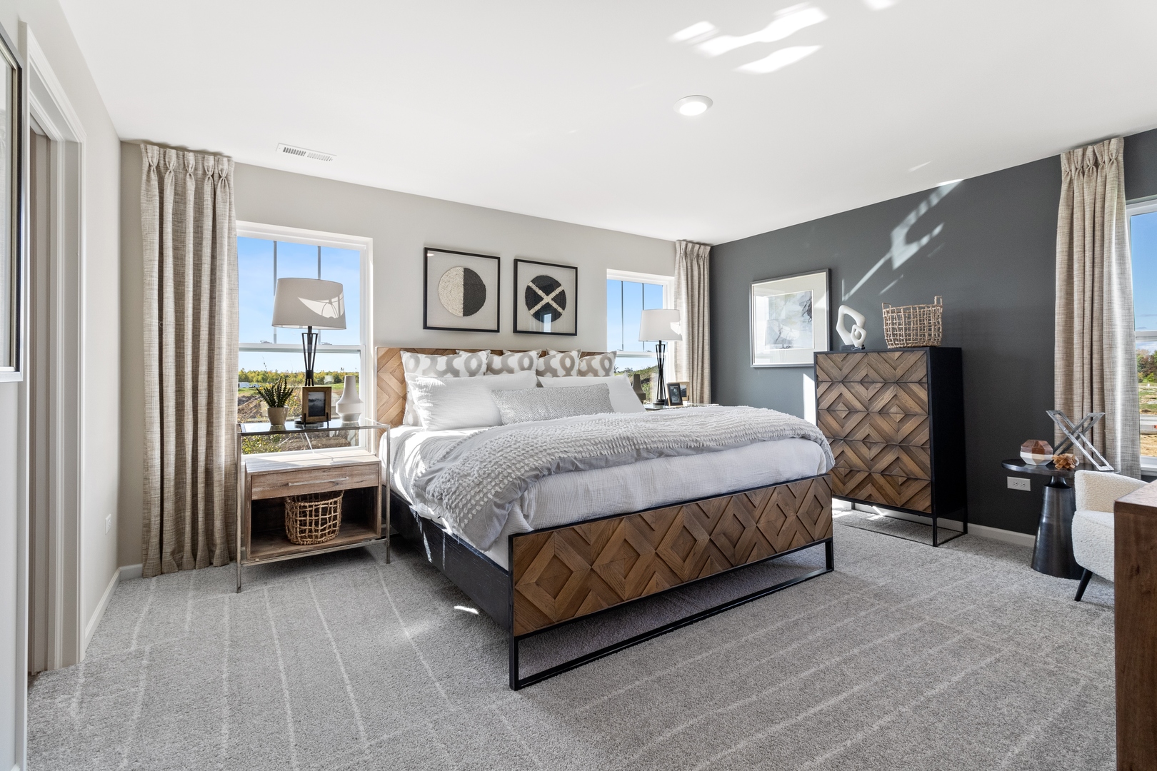 25626 West Springview Drive Plainfield, IL 60586 - Photo 11 of 27 a bedroom with a bed lamp and a large window