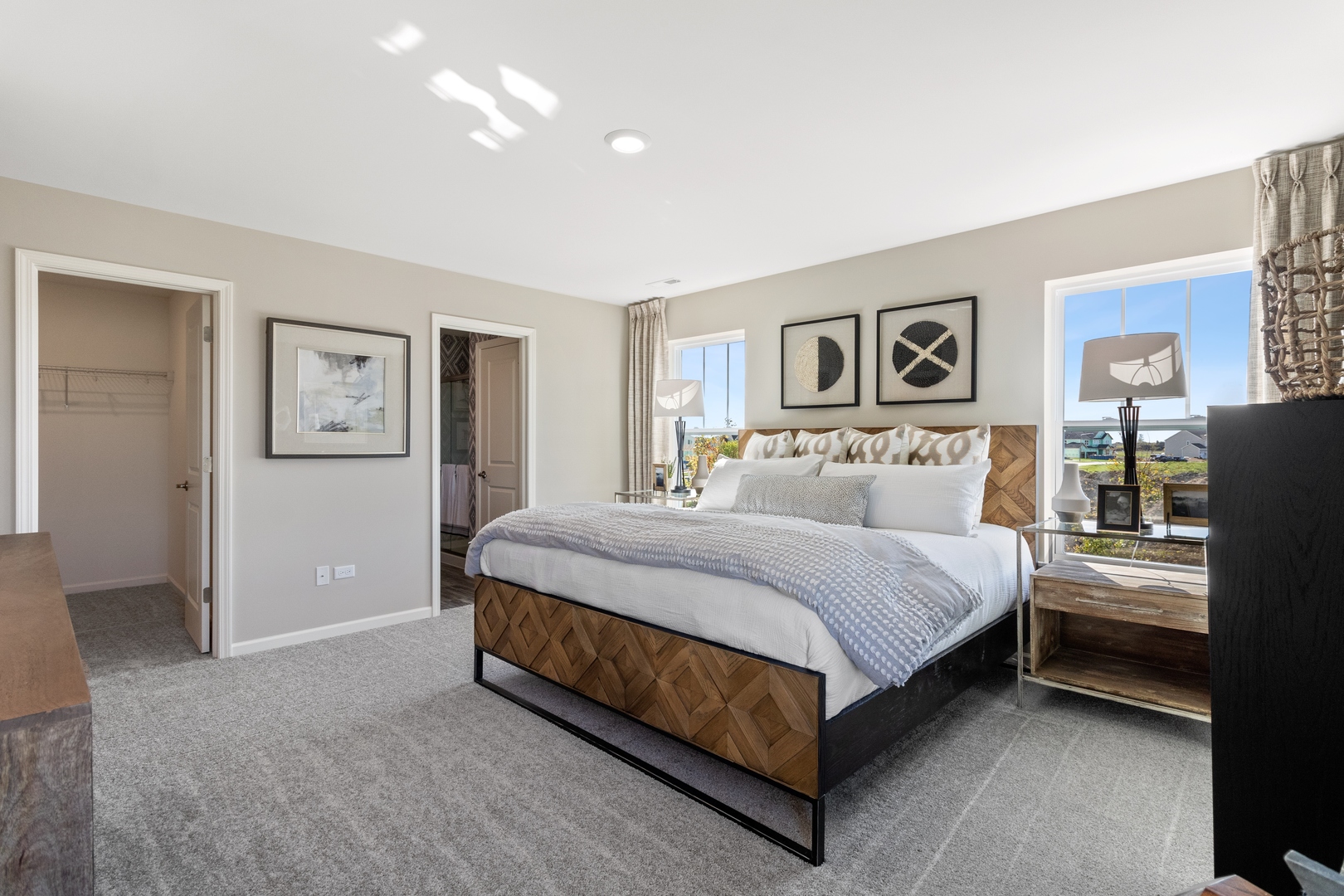 25626 West Springview Drive Plainfield, IL 60586 - Photo 12 of 27 a spacious bedroom with a bed and wall painting