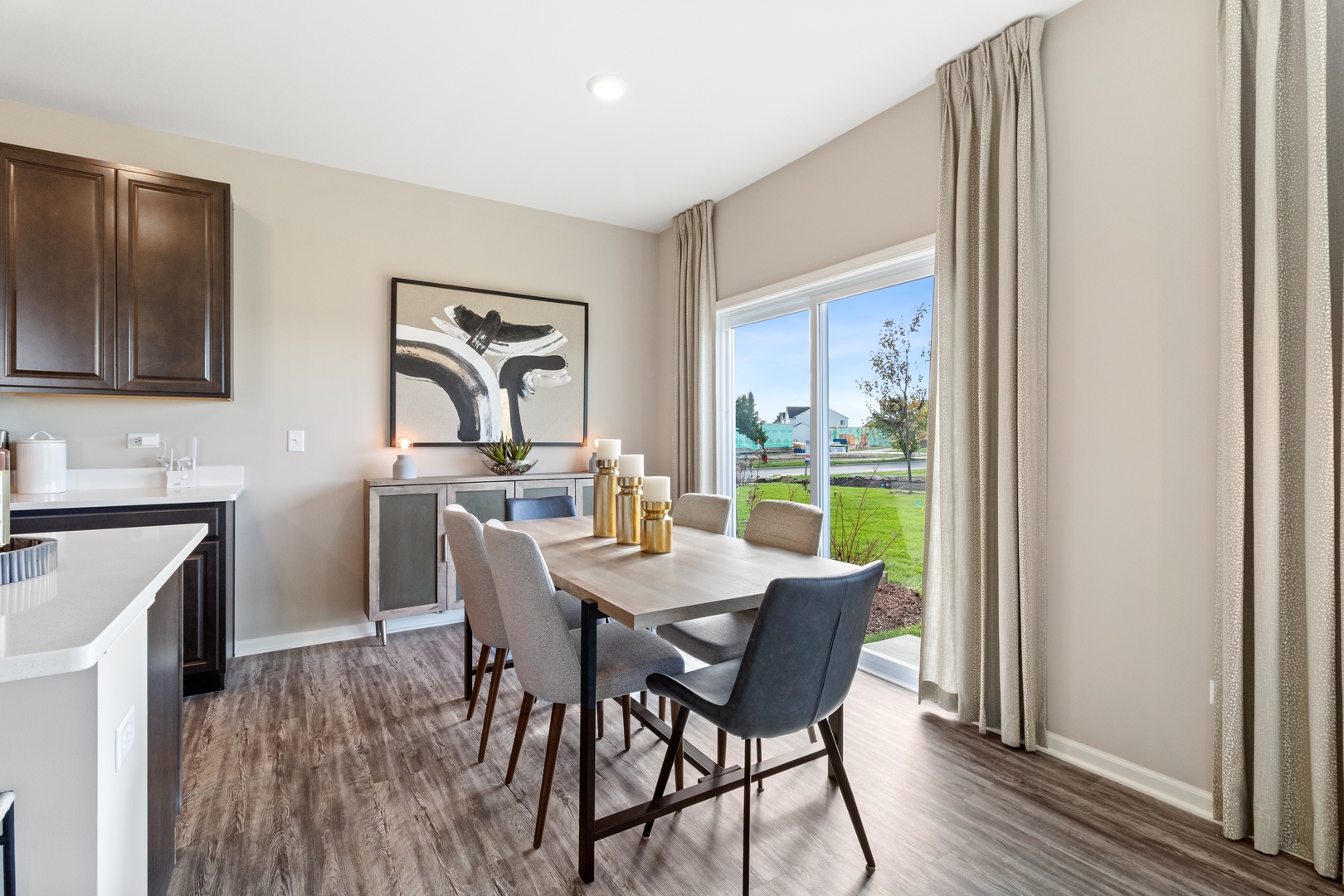 25626 West Springview Drive Plainfield, IL 60586 - Photo 9 of 27 a view of a dining room with furniture window and wooden floor