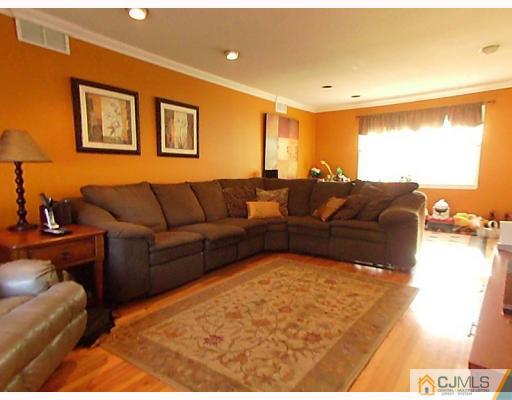 15 Lynnwood Road Edison, NJ 08820 - Photo 3 of 9 a living room with furniture and a large window