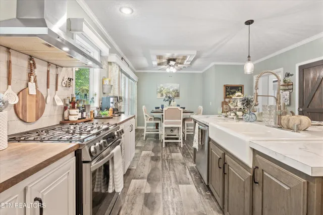 a kitchen with lots of counter space and windows