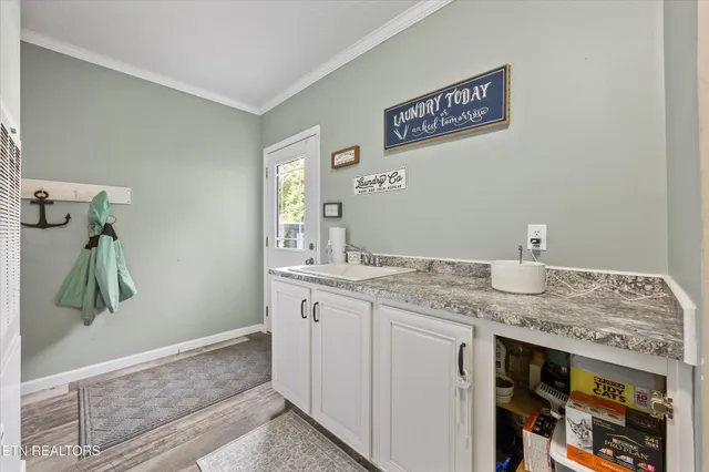 a view of a hallway with washer and dryer