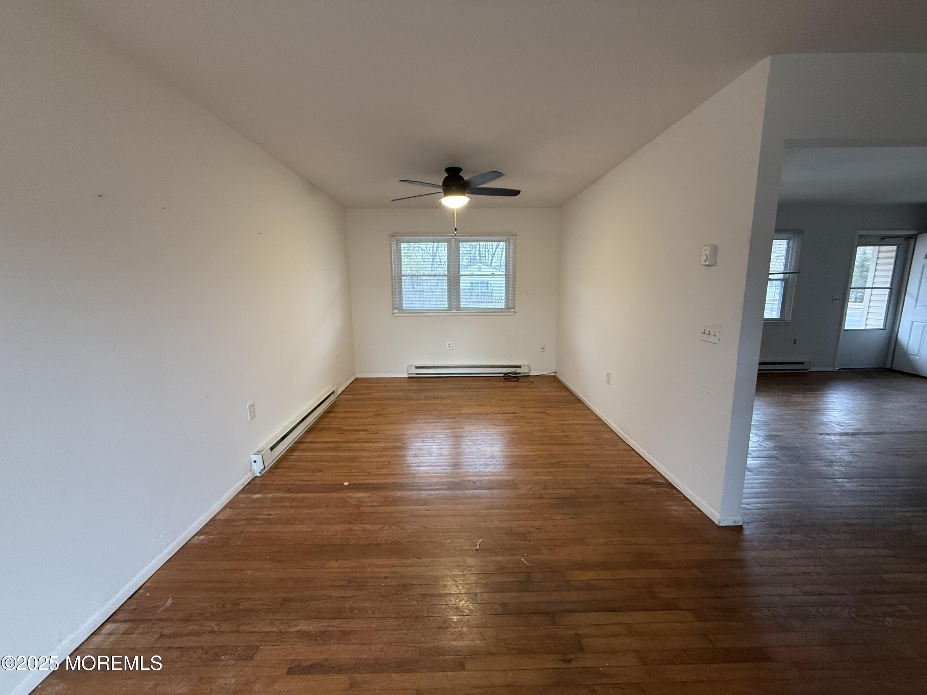 17 Afton Road Jackson, NJ 08527 - Photo 1 of 21 wooden floor in an empty room with a window