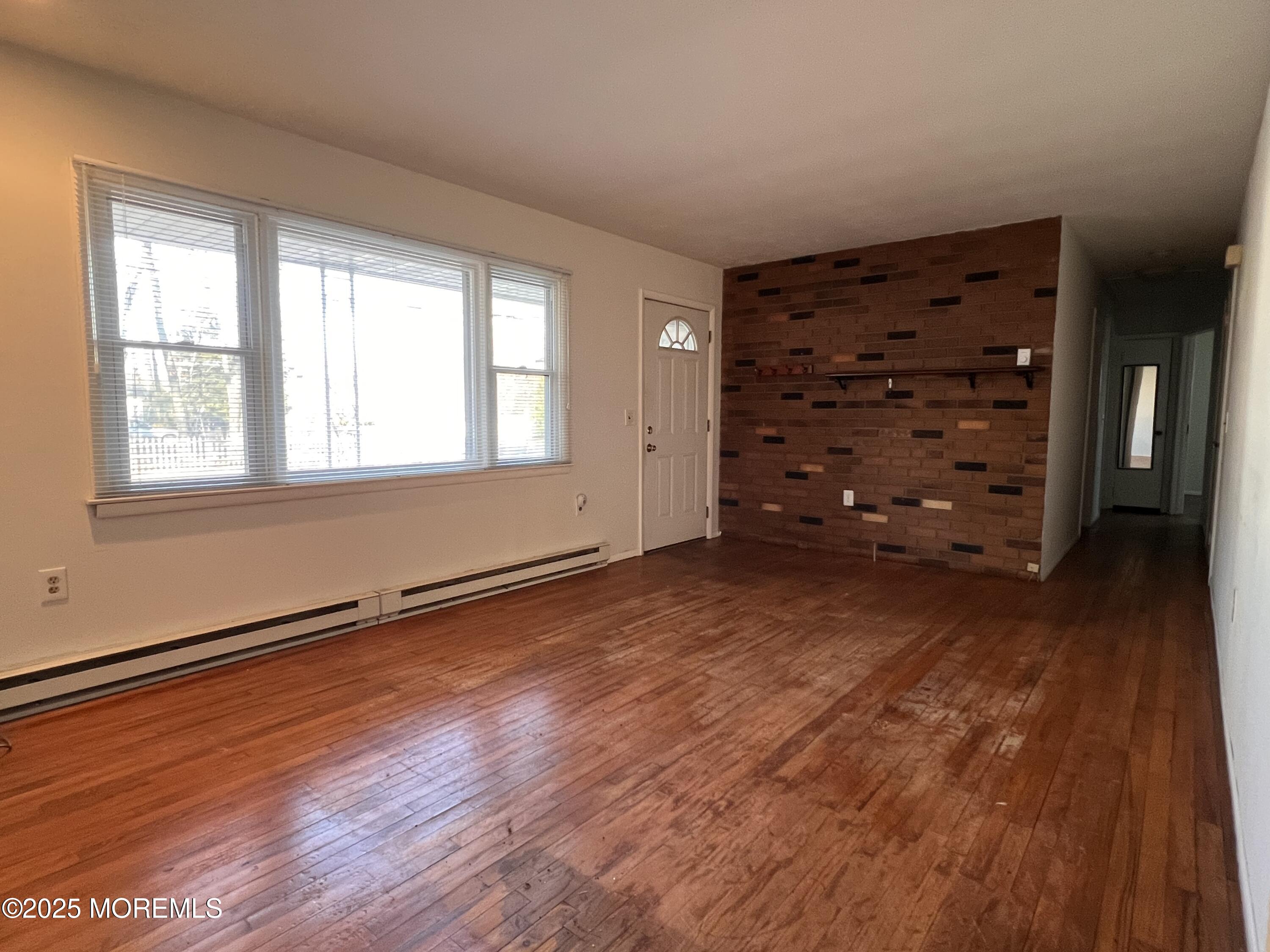 17 Afton Road Jackson, NJ 08527 - Photo 14 of 21 an empty room with wooden floor closet and windows