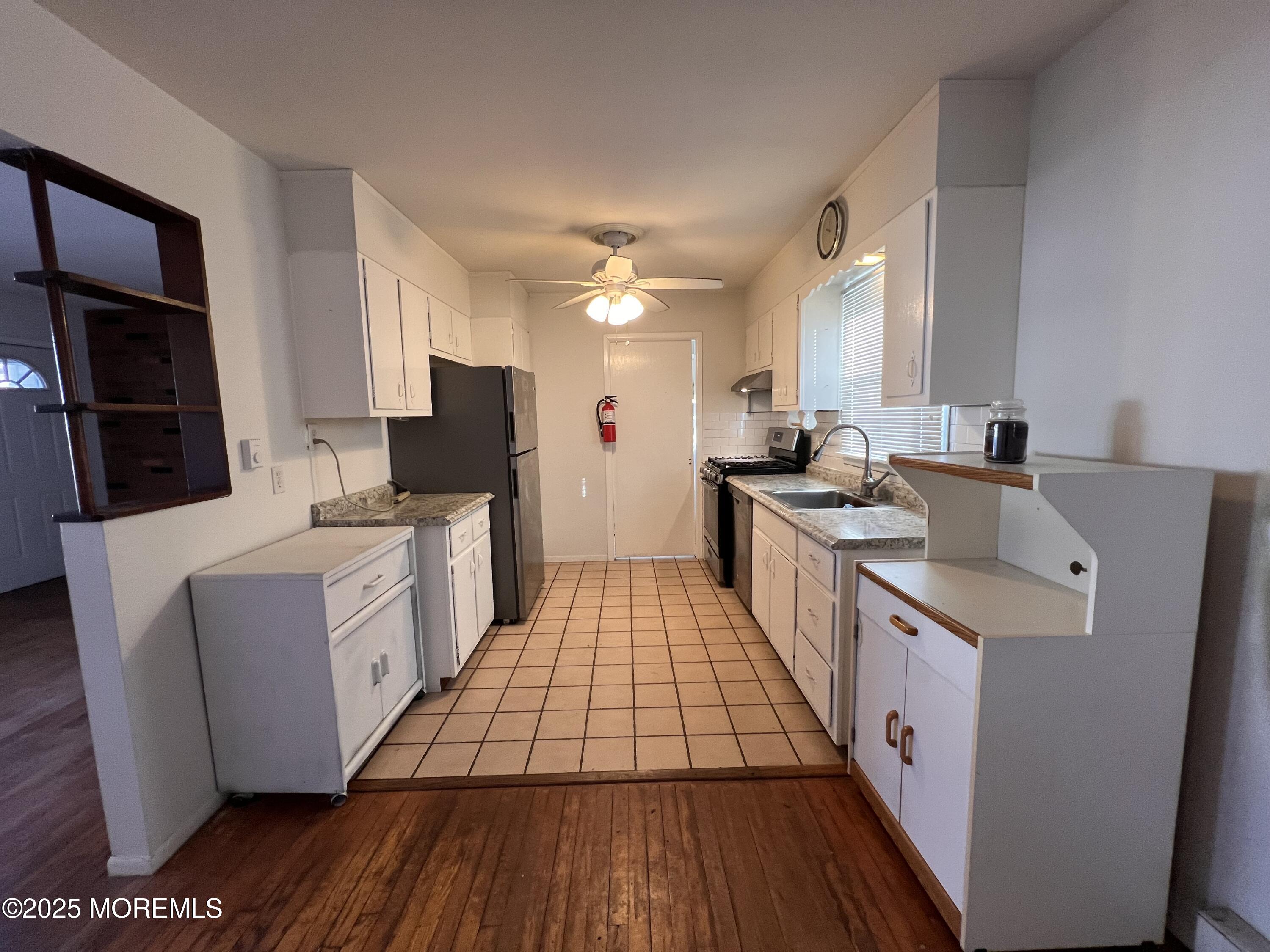 17 Afton Road Jackson, NJ 08527 - Photo 15 of 21 a kitchen with a sink stove and refrigerator